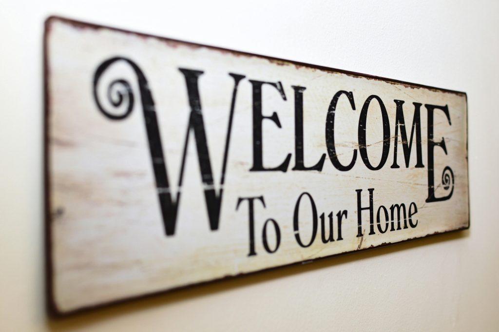 Black on white sign reading "Welcome to Our Home" - Visit Phaselectric.com.